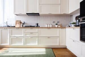New home kitchen with white wooden furniture