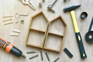 House building and maintenance, DIY and construction tools on wooden background.