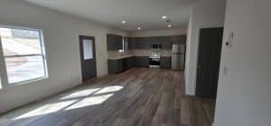 Open living area and kitchen in a new home built by JCG