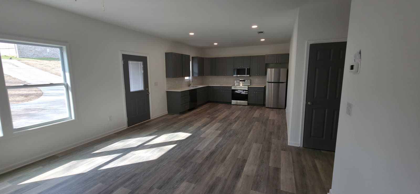 Open living area and kitchen in a new home built by JCG